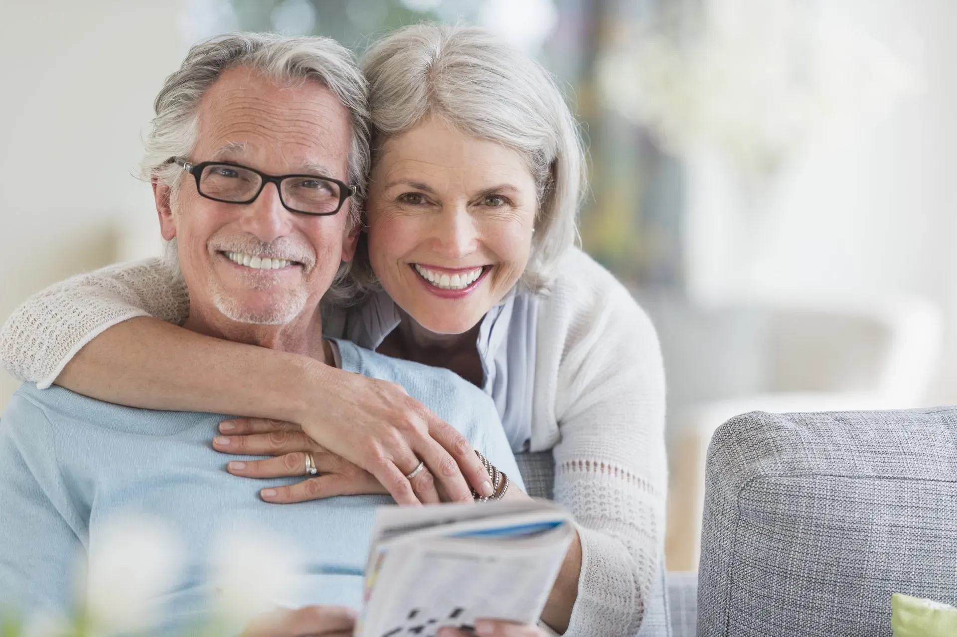 Smiling senior couple relaxing together at home